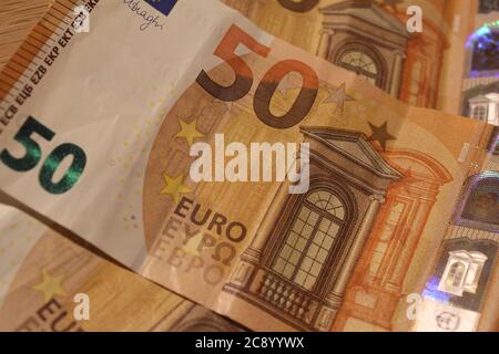 Euro's bills and coins. /Ana Bornay Stock Photo