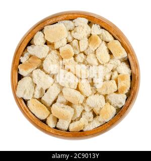 Dry bread cubes for stuffing, in a wooden bowl. Made of rolls, cut into cubes and dried, used for bread stuffing recipes like bread dumplings. Stock Photo