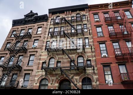 Low Angle View of Three Urban Apartment Buildings Stock Photo