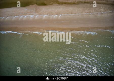 This unique photo shows the beach at Pak Nam Pran in Thailand photographed from above. You can see the sea and how the waves break on the beach Stock Photo