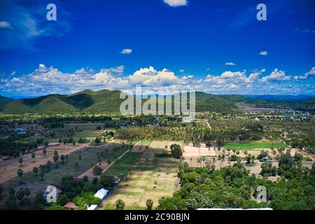 This unique photo shows the city of Pak Nam Pran in Thailand. The tropical landscape and mountains can be seen with a bright blue but slightly cloudy Stock Photo