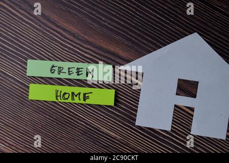 Green Home text write on sticky notes isolated on office desk. Stock Photo