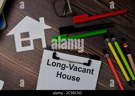 Long-Vacant House text write on paperwork isolated on office desk. Stock Photo