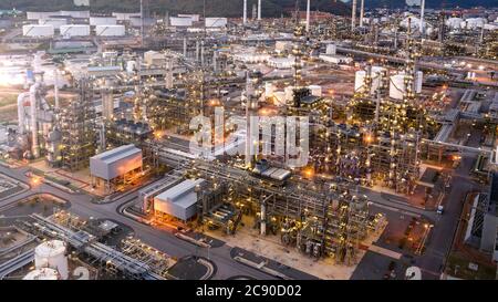 Aerial view of Oil refinery plant in twilight time, Petrochemical industry is important to the global economy. Stock Photo