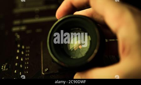 Excellent manual camera lens within yellow lights, iris adjusted by hand Stock Photo
