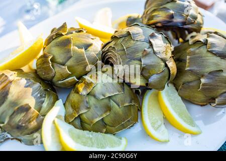 Grilled artichokes with lemon Stock Photo