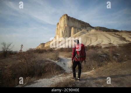 Ukraine, Crimea, Hiker looking at White Mountain Stock Photo