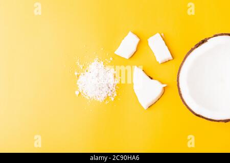 Happy coconuts day concept, fresh coconut group set different half and slices, studio shot isolated on yellow background Stock Photo