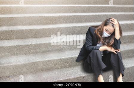 sadness asian woman lost job in coronavirus crisis making failure unemployment and depressed economic Stock Photo