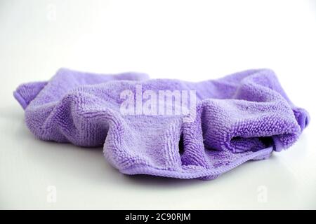 Purple microfiber cloth isolated on white background   X Stock Photo