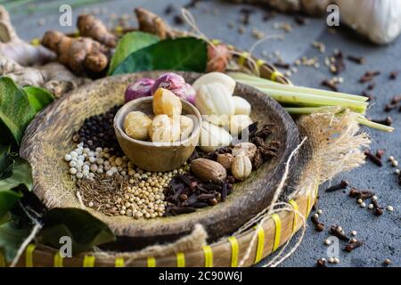 Native spices of Indonesia. Spices such as nutmeg or mace, cloves, pandanus leaves, palm trees, and galangal are native to Indonesia. the secret of th Stock Photo