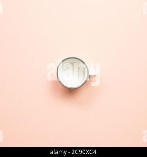 White empty mug cup on pink background. top view Stock Photo