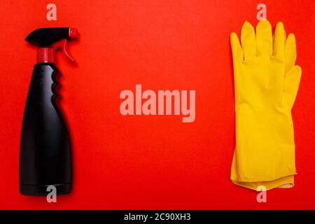 black wiper and gloves on a red background. Copyspace Stock Photo
