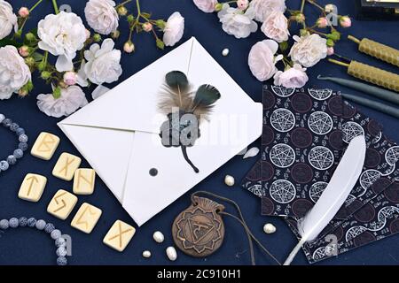 Tarot cards, runes and magic objects on witch table.  Mystic and romantic background with copy space and blank, vintage romantic concept for mock up, Stock Photo