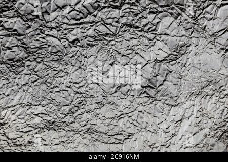 Crumpled wrinkled silver foil texture Stock Photo
