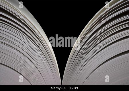 Open book with open pages on both sides. Isolated on black Stock Photo
