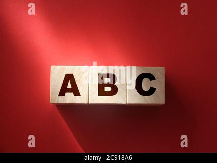 ABC letters wooden blocks on red. Education concept Stock Photo
