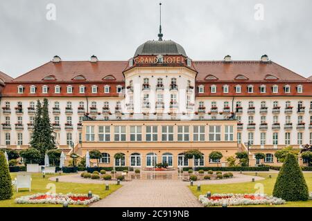 The majestic Grand Hotel at Sopot on the Baltic Sea coast near Gdansk seen from the beach and park side, Poland. Stock Photo