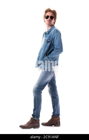 Side View of Man Wearing Brown Jacket and Denim Pants · Free Stock Photo