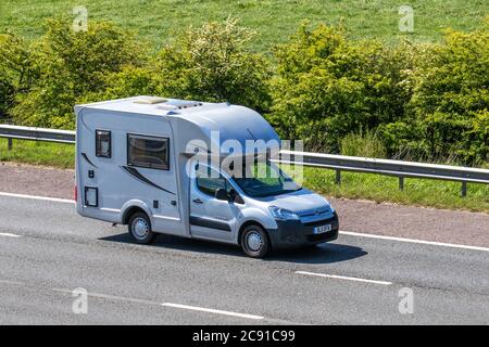 2011 white Citroën Berlingo 1000 X HDI; Touring Caravans and Motorhomes, campervans on Britain's roads, RV leisure vehicle, family holidays, caravanette vacations, french caravan holiday, van conversions, autohome, life on the road, Stock Photo