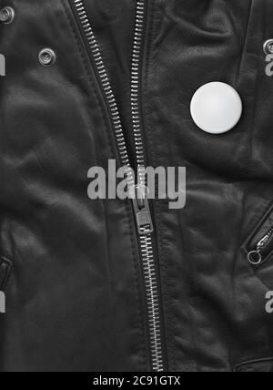 Badge on a Black leather jacket close-up view. Texture Background Stock Photo