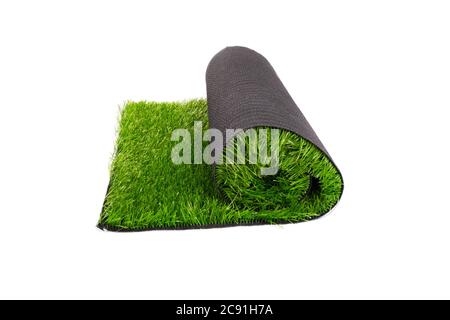 roll of artificial green grass on white background, coating. Stock Photo