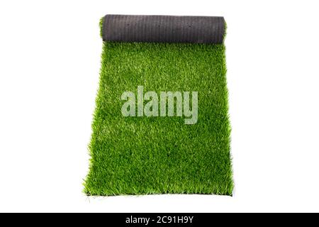 coating, roll of green grass on white background, artificial grass. Stock Photo