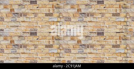 Yellow burned brick wall seamless background Stock Photo