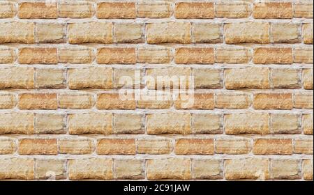 Yellow burned brick wall seamless background Stock Photo