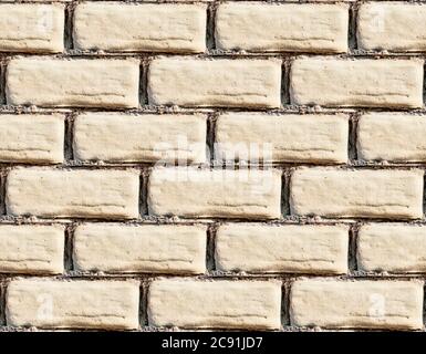 Yellow burned brick wall seamless background Stock Photo