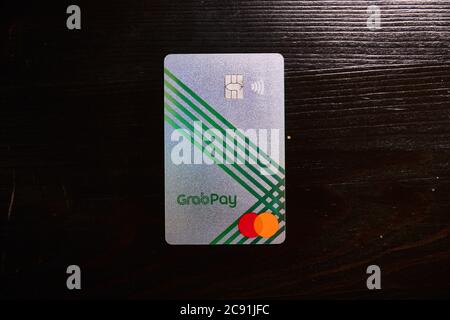 SINGAPORE, SINGAPORE - Jul 01, 2020: A photo of the GrabPay  Prepaid Debit Mastercard. Featuring enhanced security with no card number imprinted. Stock Photo