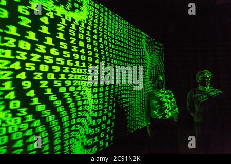 London, UK.  28 July 2020. Staff members experience the 3D video installation '12345678', 2017, by Kraftwerk.  Preview of 'Electronic: From Kraftwerk to The Chemical Brothers' at the Design Museum in Kensington which is reopening after coronavirus lockdown.  The new exhibition explores the hypnotic world of electronic music, from its origins to its futuristic dreams.  The show runs 31 July 2020 – 14 February 2021 with visitors required to adhere to strict social distancing guidelines. Credit: Stephen Chung / Alamy Live News Stock Photo