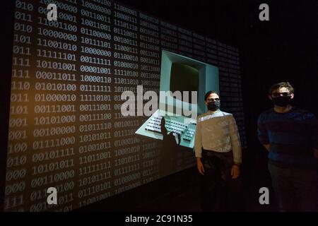 London, UK.  28 July 2020. Staff members experience the 3D video installation '12345678', 2017, by Kraftwerk.  Preview of 'Electronic: From Kraftwerk to The Chemical Brothers' at the Design Museum in Kensington which is reopening after coronavirus lockdown.  The new exhibition explores the hypnotic world of electronic music, from its origins to its futuristic dreams.  The show runs 31 July 2020 – 14 February 2021 with visitors required to adhere to strict social distancing guidelines. Credit: Stephen Chung / Alamy Live News Stock Photo
