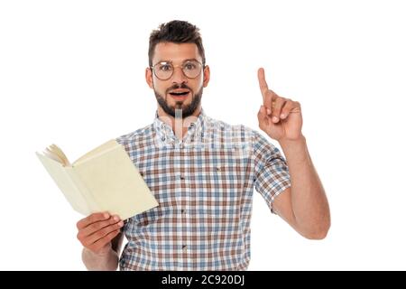 Excited nerd having idea while holding open book isolated on white Stock Photo