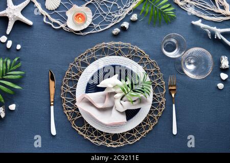 Contemporary Summer Table Setting With Nautical Sea Decorations On Blue And  White Stripy Runner Classic Blue White Plates Utensils On White Rustic  Table Top View Casual Modern Lunch Stock Photo - Download