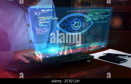 Hacker spy attack with cyber eye on computer screen. Hacking, control, surveillance, supervise, digital invigilation and breach of privacy concept 3d Stock Photo