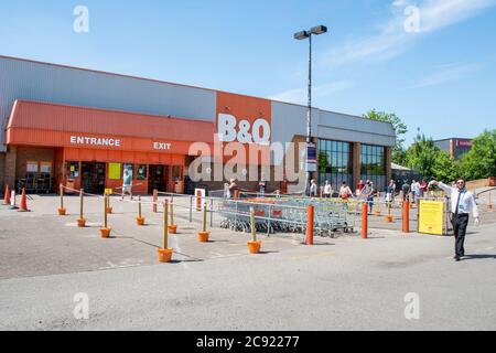 Sheffield UK –  June 02 2020: socially distanced queue formation marked by cones outside the DIY superstore at B&Q, Penistone Road, Hillsborough Stock Photo