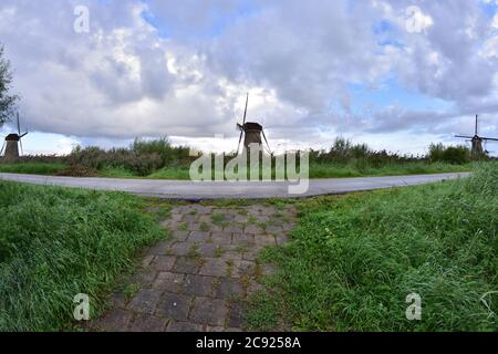 Windmills at Kinderdijk on a cloudy summer day in the Netherlands. Summer. Stock Photo