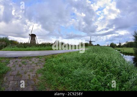 Windmills at Kinderdijk on a cloudy summer day in the Netherlands. Summer. Stock Photo