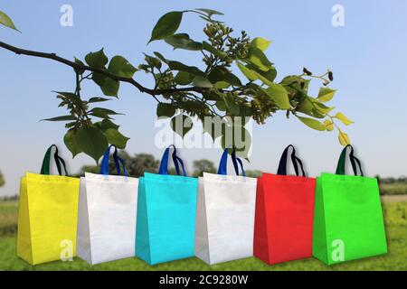 Colorful fabric bags on natural background Stock Photo