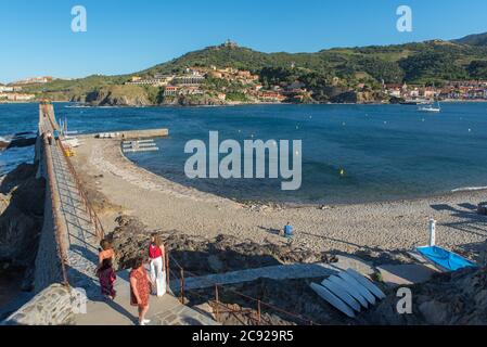 COLLIUORE, FRANCE - Jun 30, 2020: Colioure, France - July 21, 2020: Tourists near chapel of Saint Vincent in sea of Collioure in south of France. Stock Photo