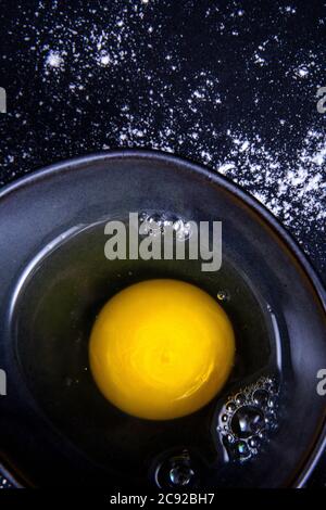 Close-up image of an egg yolk in a bowl. Stock Photo
