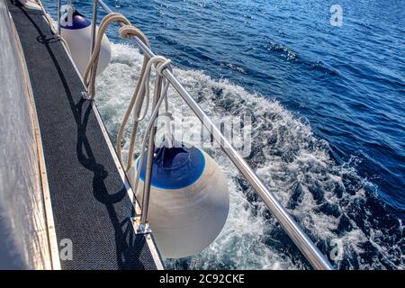 Boat Fenders and Buoys . Aboard the ship . Traveling by Sea Stock Photo