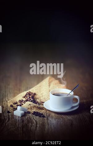 coffee beans with white cup,black background Stock Photo