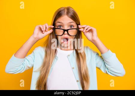 Photo of beautiful pretty little blond lady diligent student pupil take off glasses open mouth see bad grade mark year wear specs casual shirt Stock Photo