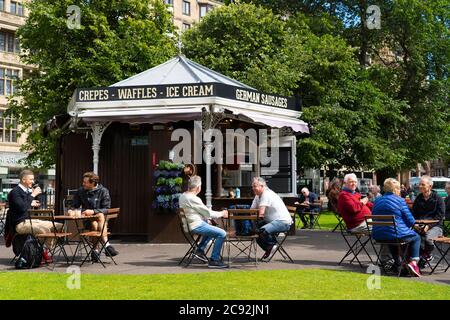 Edinburgh, Scotland, UK. 28 July, 2020. Business and tourism slowly returning to the shops and streets of Edinburgh city centre. The public returning to enjoy cafe inside East Princes Street Gardens which have recently reopened after landscaping and drainage improvement works. Iain Masterton/Alamy Live News