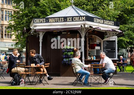 Edinburgh, Scotland, UK. 28 July, 2020. Business and tourism slowly returning to the shops and streets of Edinburgh city centre. The public returning to enjoy cafe inside East Princes Street Gardens which have recently reopened after landscaping and drainage improvement works. Iain Masterton/Alamy Live News