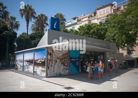 Malaga, Spain. 27th July, 2020. A group of tourists looking at a map outside a tourism office at Plaza de la Marina square in downtown city.The government of UK has imposed a quarantine to all tourists that travel from Spain because of its high levels of COVID-19 cases while Germany does not recommend traveling to some regions of Spain. The tourist sector of Costa del Sol in Andalusia is the most affected by the UK decision that coincides with the summer session. British tourism represents the most foreign investment in Malaga. Credit: Jesus Merida/SOPA Images/ZUMA Wire/Alamy Live News Stock Photo