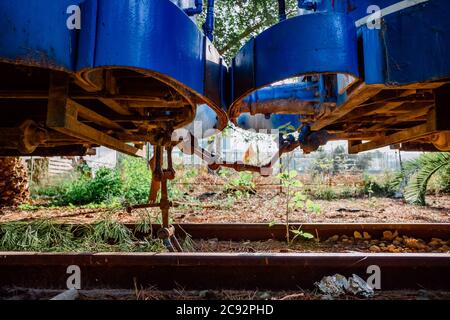 Two abandoned train cars linked by their links. Stock Photo
