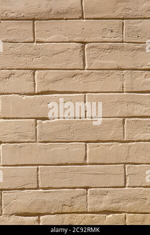 brown brick wall, the texture of the wall is made of brick blocks. Stock Photo